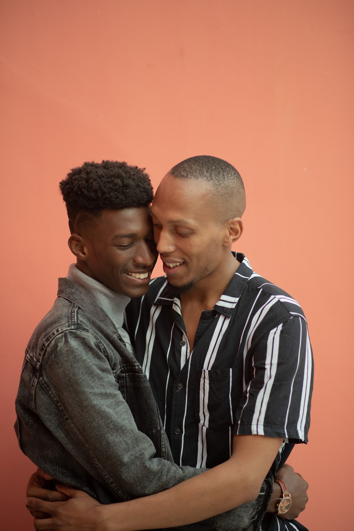 Two men happily cuddling